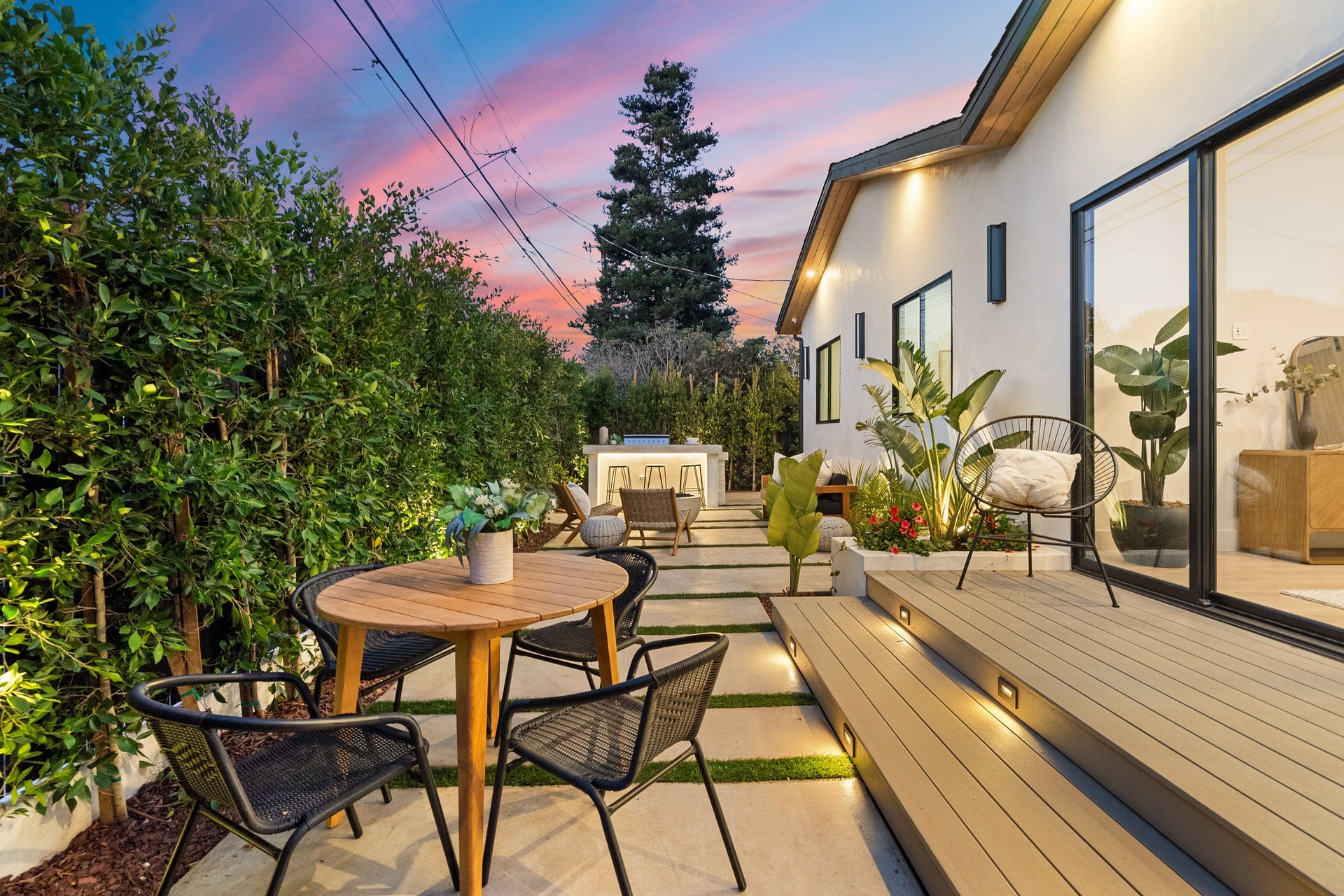 Modern backyard patio at sunset.